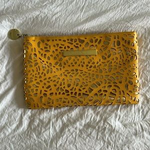 Yellow\gold clutch by Ivanka Trump
